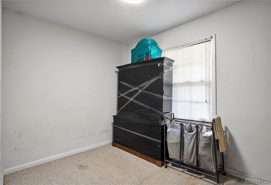 20007 Eugene Drive Sutherland, VA 23885 - Photo 16 of 21 an empty room with wooden floor and windows
