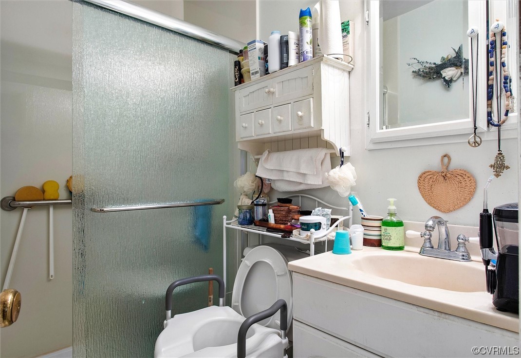 20007 Eugene Drive Sutherland, VA 23885 - Photo 17 of 21 a bathroom with a sink and a mirror