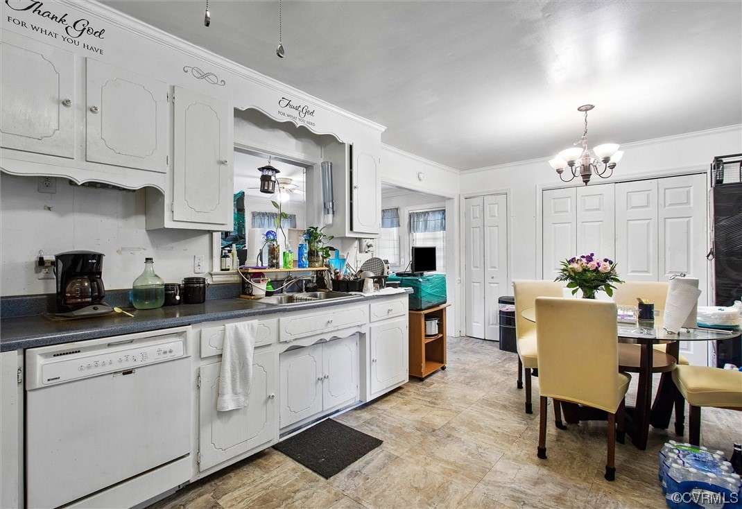 20007 Eugene Drive Sutherland, VA 23885 - Photo 8 of 21 a kitchen with white cabinets and wooden floor