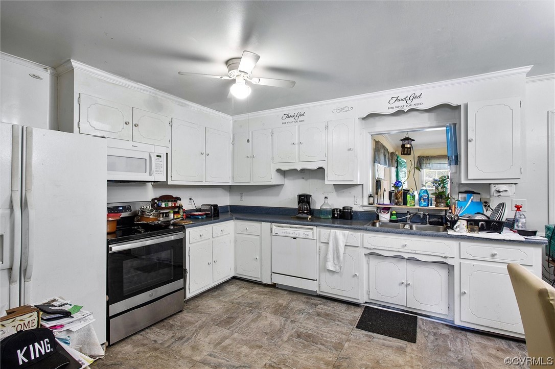 20007 Eugene Drive Sutherland, VA 23885 - Photo 9 of 21 a kitchen with a white cabinets and white appliances
