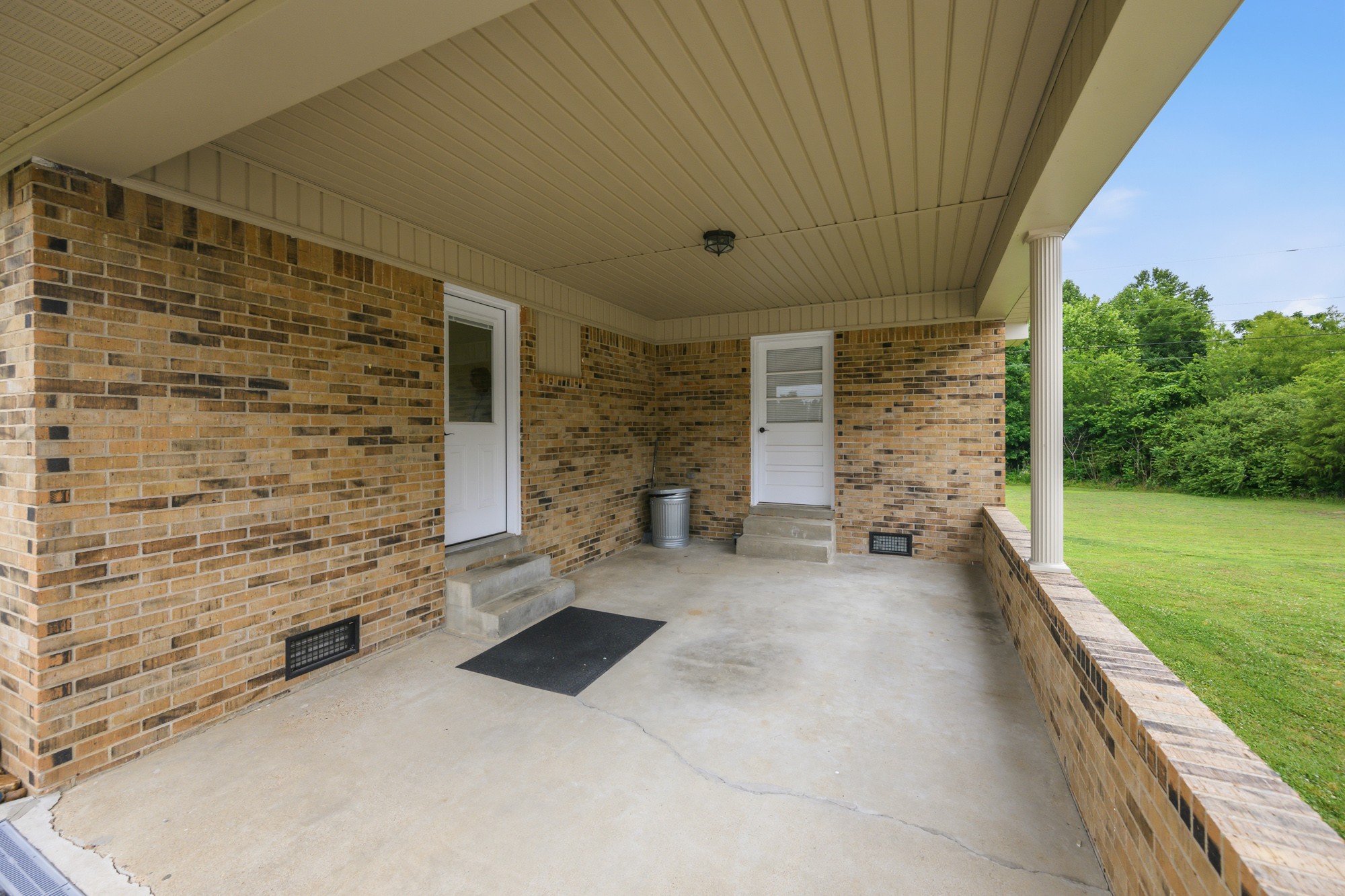 944 Brooksie Thompson Road Decaturville, TN 38329 - Photo 30 of 47 a view of a patio with table and chairs with the garden