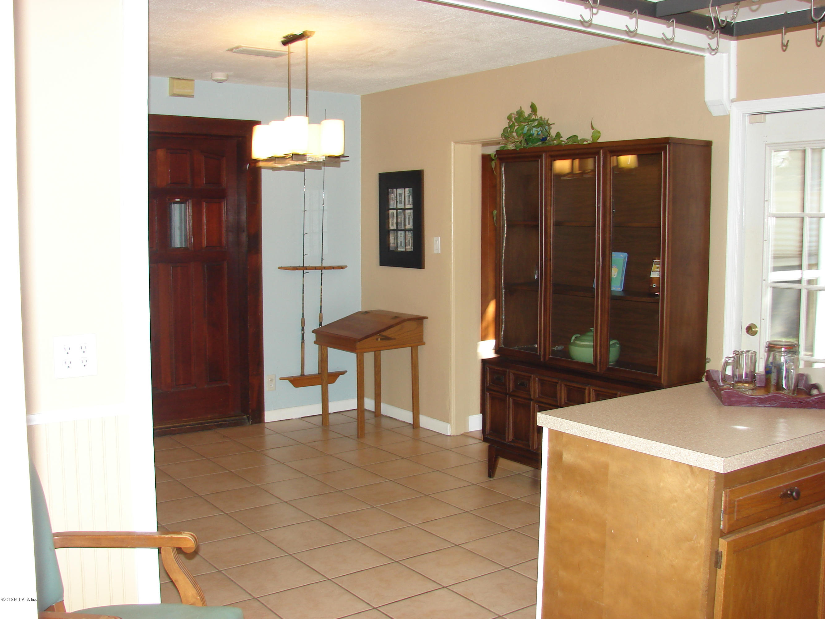 6301 Colgate Road Jacksonville, FL 32217 - Photo 14 of 24 a dining room with furniture and window