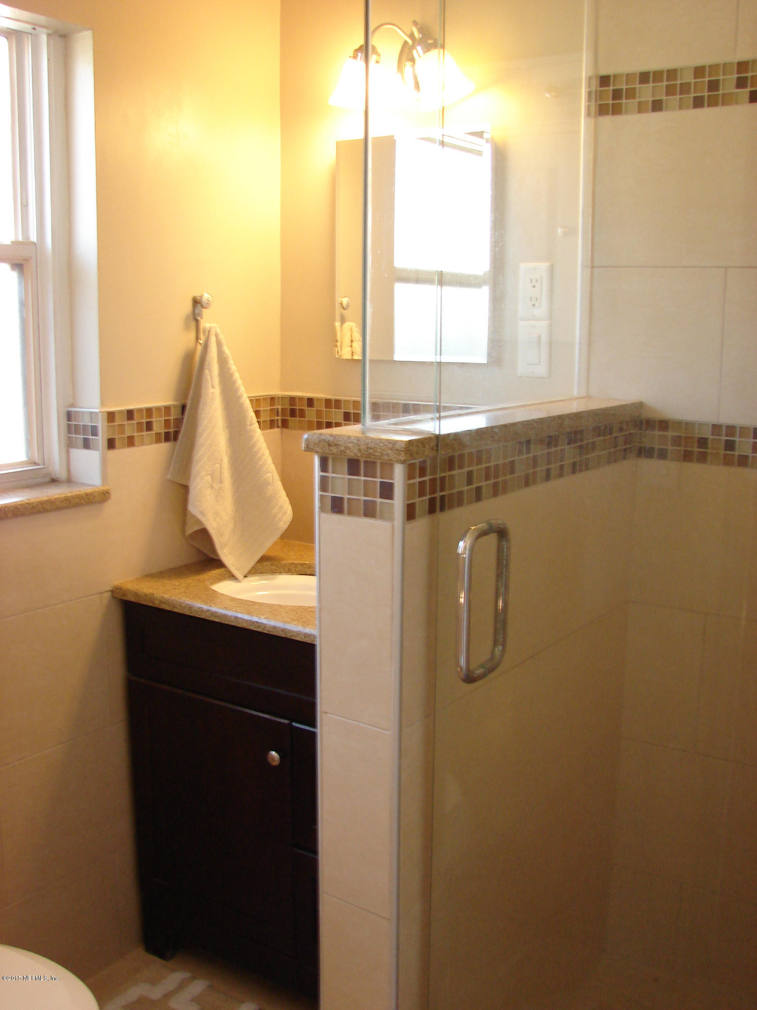 6301 Colgate Road Jacksonville, FL 32217 - Photo 6 of 24 a view of a bathroom with a sink