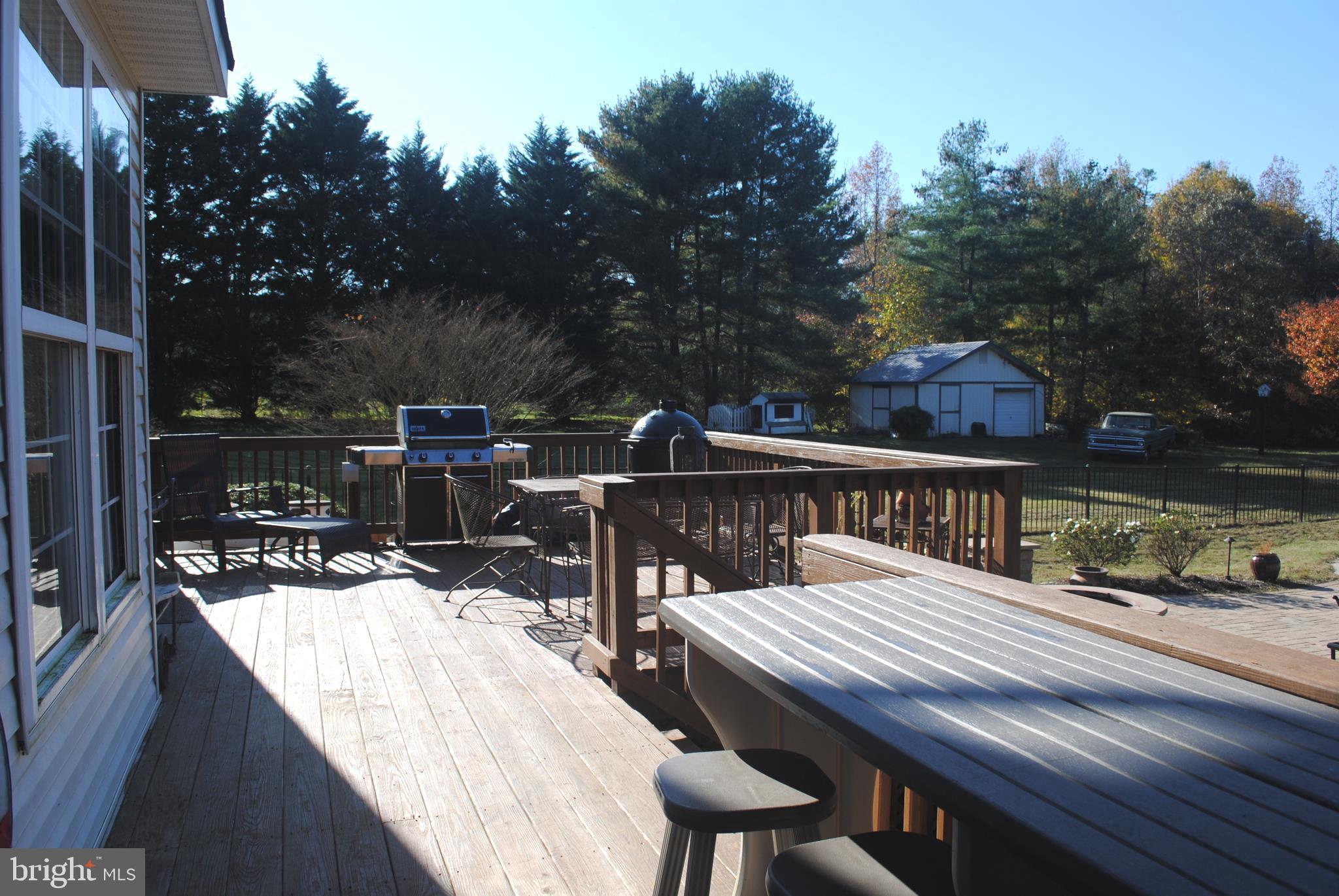 19095 Ridge Road Colonial Beach, VA 22443 - Photo 16 of 57 Back deck with grill and dining area.