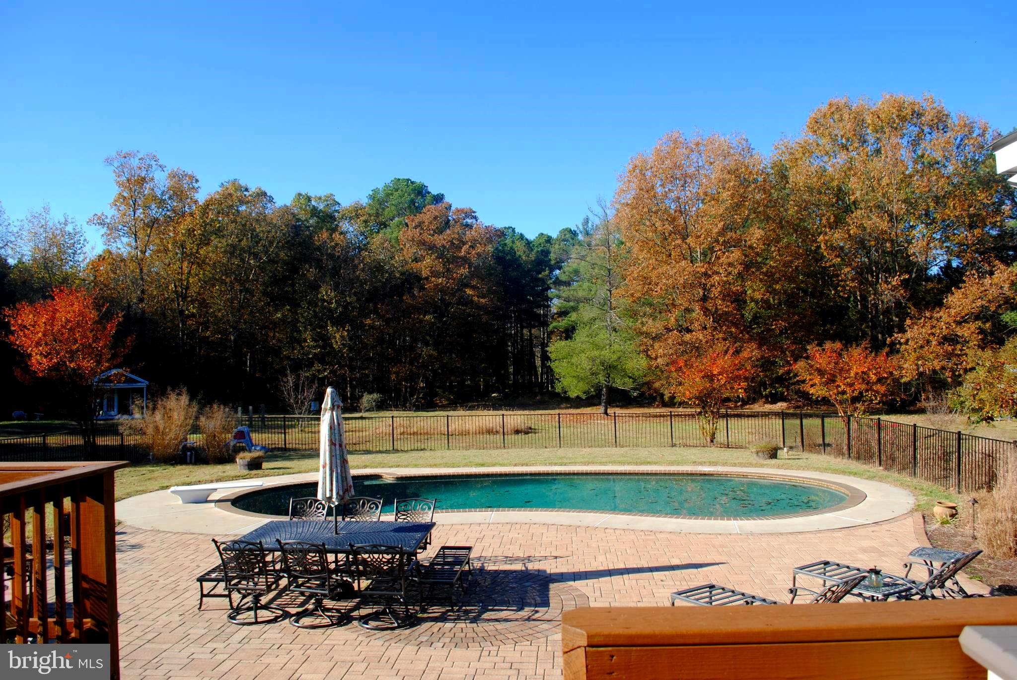 19095 Ridge Road Colonial Beach, VA 22443 - Photo 18 of 57 Enclosed patio with in-ground saltwater pool.
