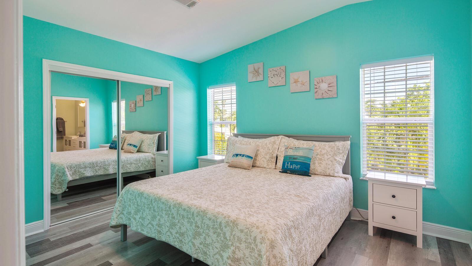 32 Beach Drive Key West, FL 33040 - Photo 13 of 33 a bedroom with a bed and a large window