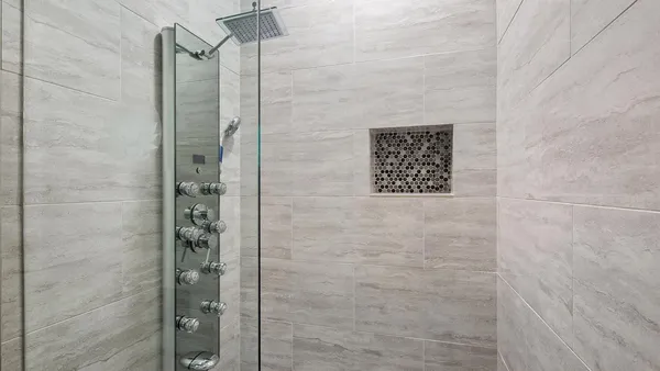 a bathroom with a shower and a sink