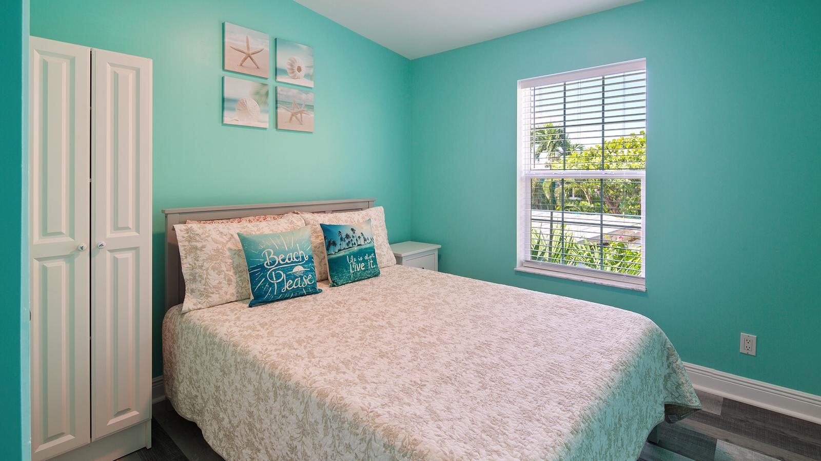 32 Beach Drive Key West, FL 33040 - Photo 21 of 33 a bedroom with a bed and window