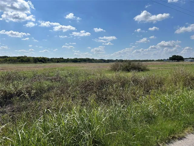 a view of a lake with a big yard