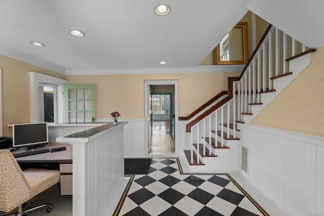 a view of a livingroom with furniture and stairs