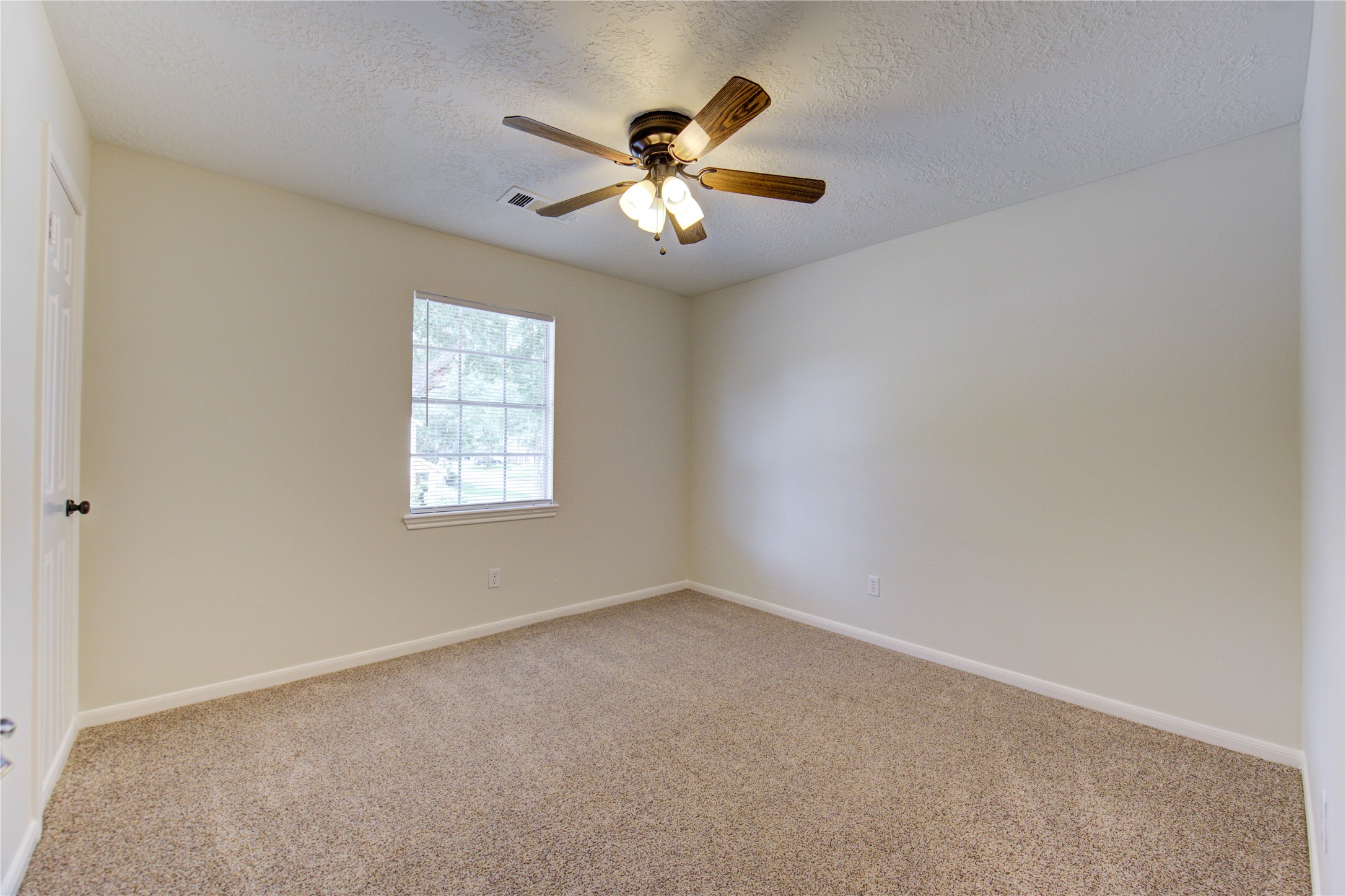 9115 Taidswood Drive Spring, TX 77379 - Photo 30 of 45 Bedroom 5 - All bedrooms have lighted ceiling fans, neutral paint and carpeting, and large walk-in closets!