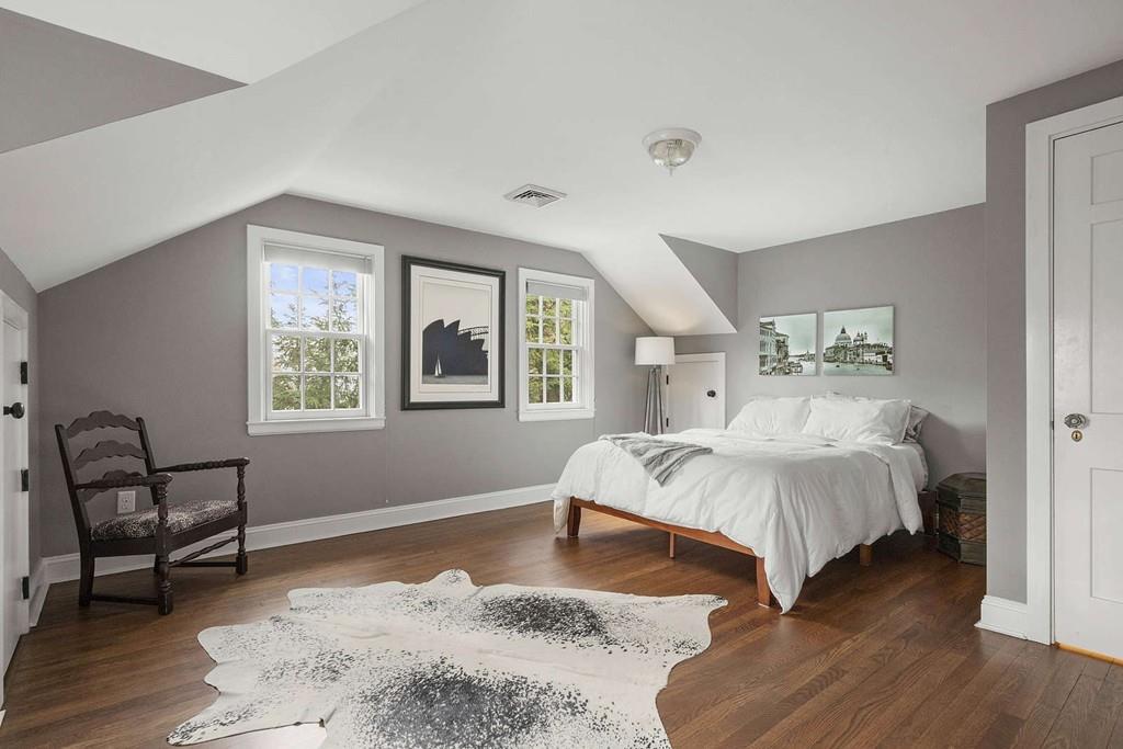 80 Audubon Road Wellesley, MA 02481 - Photo 19 of 33 a spacious bedroom with a bed and a window
