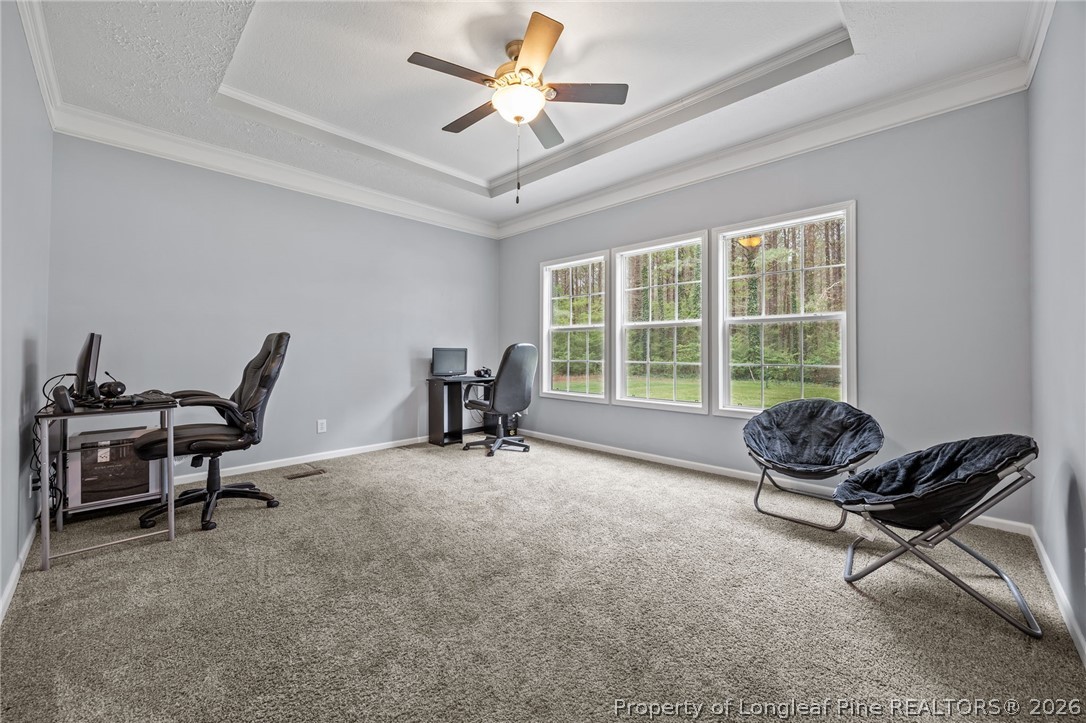 2252 Old Stage Road South Erwin, NC 28339 - Photo 14 of 47 a living room with furniture a ceiling fan and a window