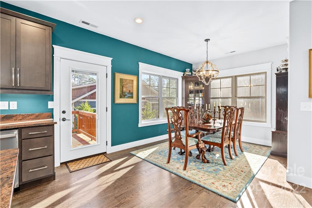 5 Feather Ridge Drive Asheville, NC 28805 - Photo 11 of 32 a view of a dining room with furniture window and wooden floor