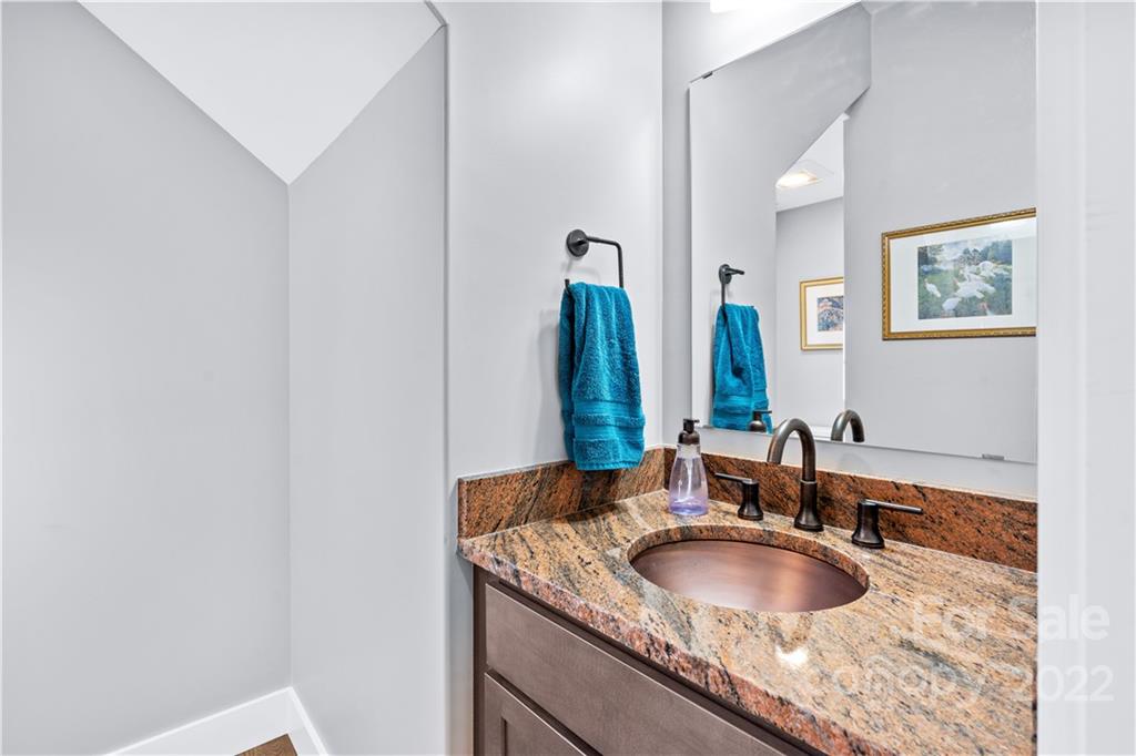 5 Feather Ridge Drive Asheville, NC 28805 - Photo 14 of 32 a bathroom with a granite countertop sink and a mirror