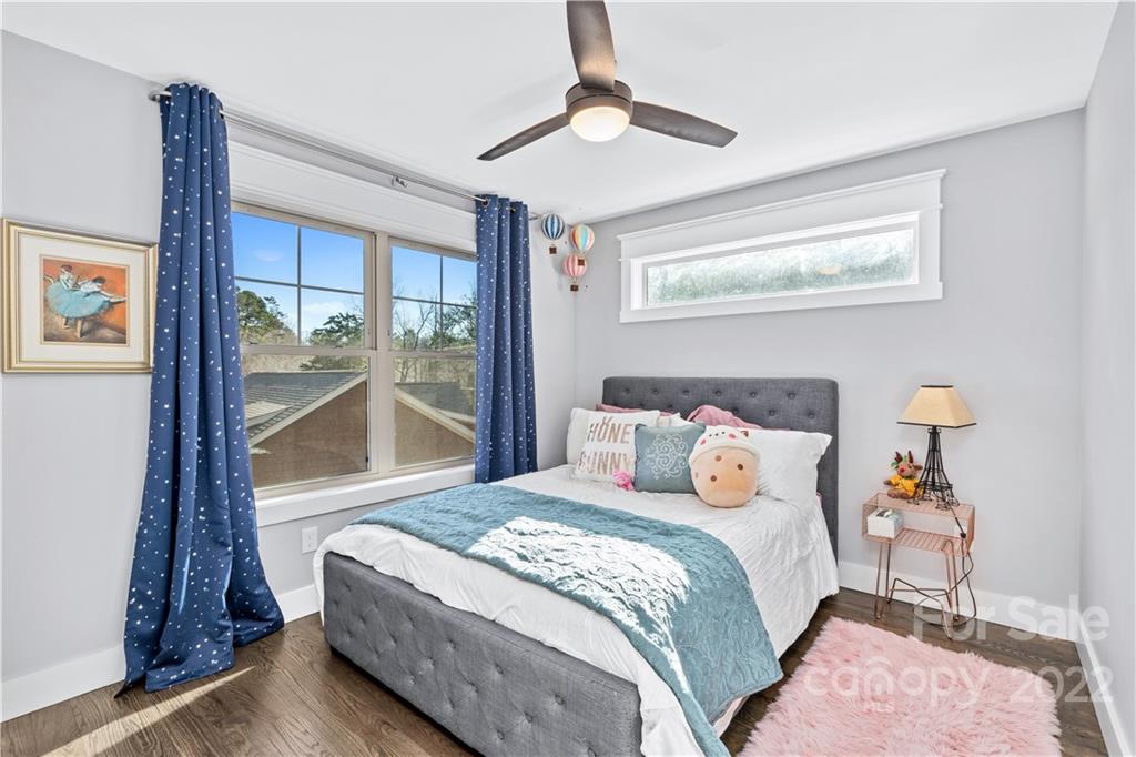 5 Feather Ridge Drive Asheville, NC 28805 - Photo 21 of 32 a bedroom with a large bed and a window