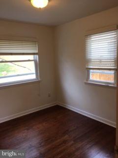 82 3rd Avenue Broomall, PA 19008 - Photo 12 of 17 a view of an empty room with wooden floor and a window