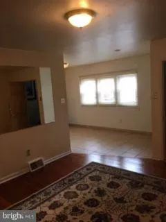 a kitchen with stainless steel appliances granite countertop a refrigerator a stove and a sink