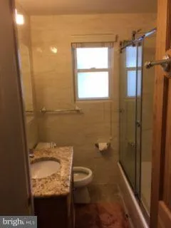 a bathroom with a glass shower door