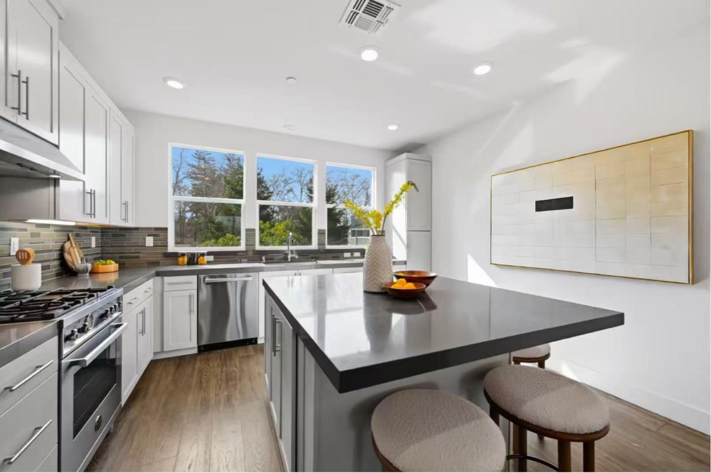 2287 Mora Place Mountain View, CA 94040 - Photo 12 of 64 a kitchen with a sink a window and chairs
