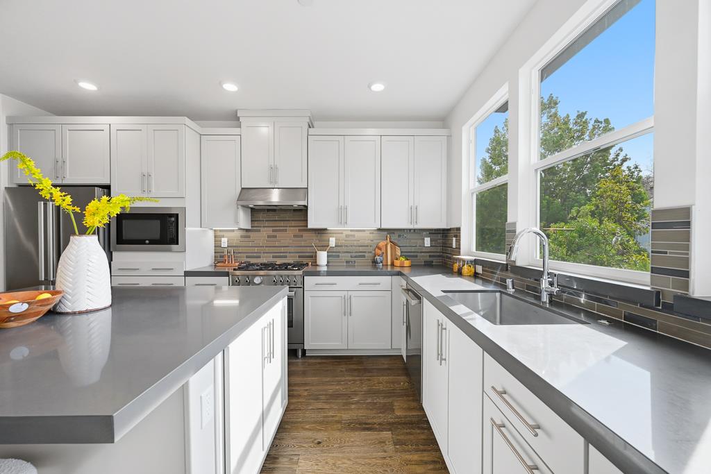 2287 Mora Place Mountain View, CA 94040 - Photo 16 of 64 a kitchen with stainless steel appliances granite countertop a sink a stove top oven a counter space and cabinets