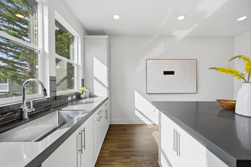 2287 Mora Place Mountain View, CA 94040 - Photo 19 of 64 a kitchen with stainless steel appliances granite countertop a sink and a stove