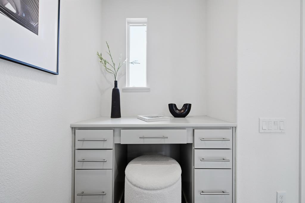 2287 Mora Place Mountain View, CA 94040 - Photo 22 of 64 a hallway with a fireplace and wooden floor