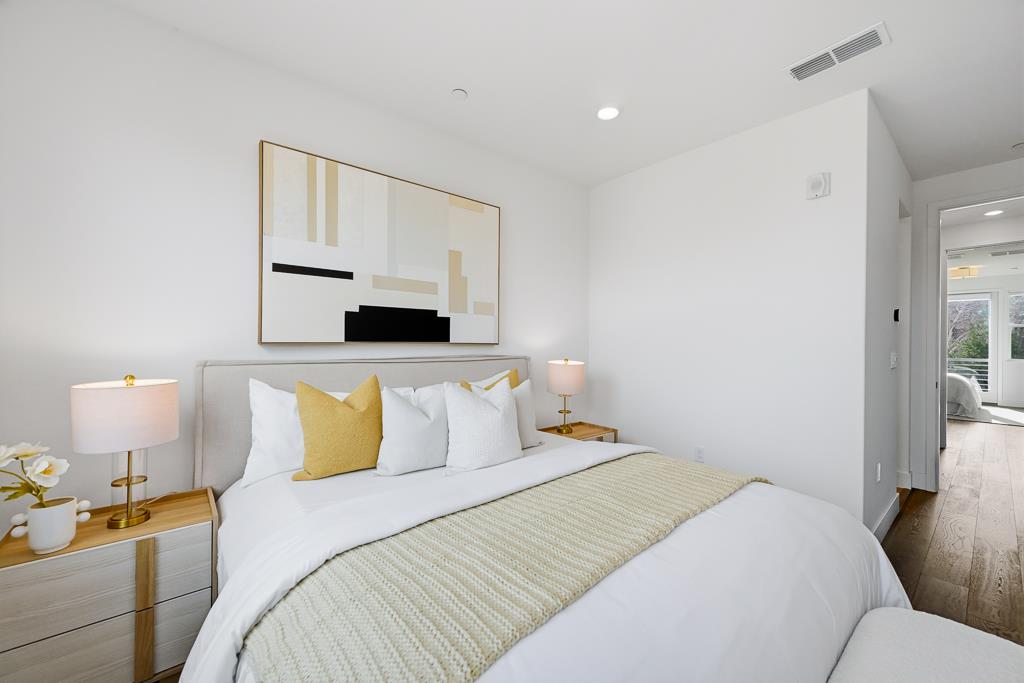 2287 Mora Place Mountain View, CA 94040 - Photo 25 of 64 a bedroom with a bed and a lamp