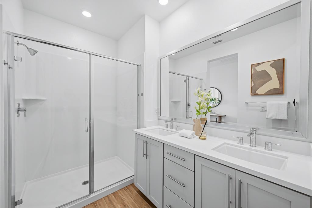 2287 Mora Place Mountain View, CA 94040 - Photo 31 of 64 a bathroom with a shower sink vanity and mirror