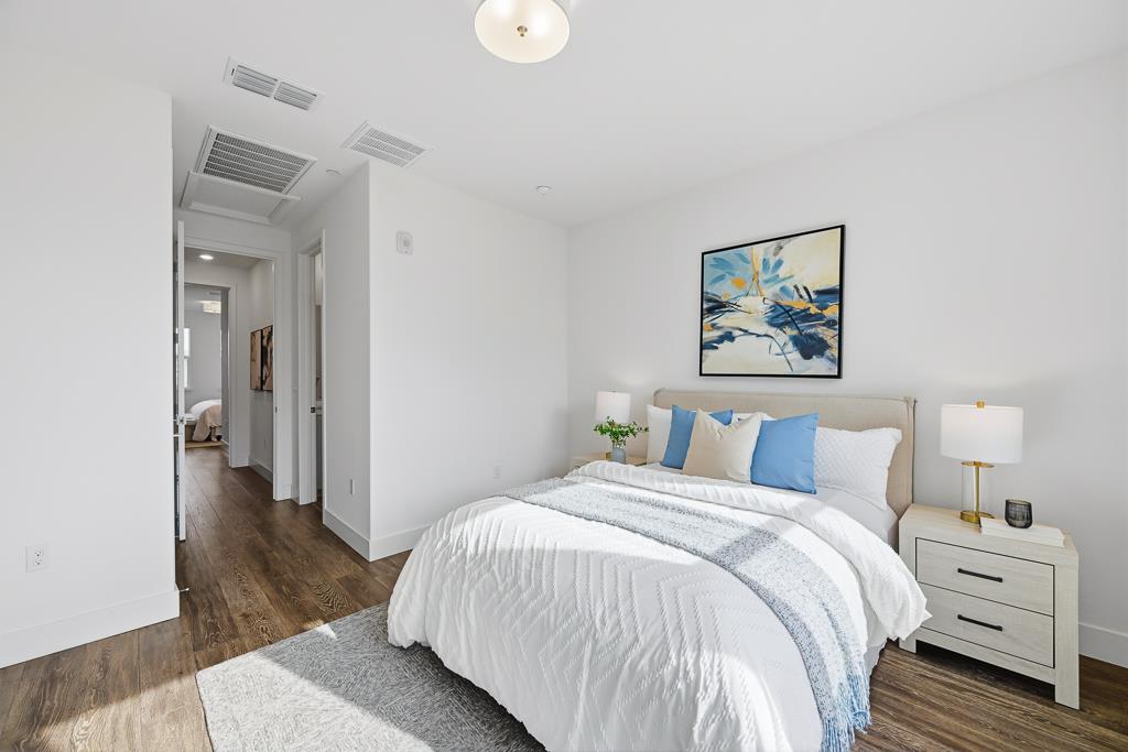 2287 Mora Place Mountain View, CA 94040 - Photo 34 of 64 a bedroom with a bed and a painting on the wall