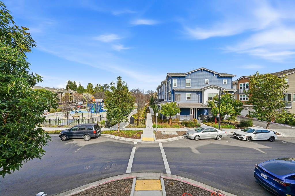 2287 Mora Place Mountain View, CA 94040 - Photo 54 of 64 a view of a city street lined with parked cars