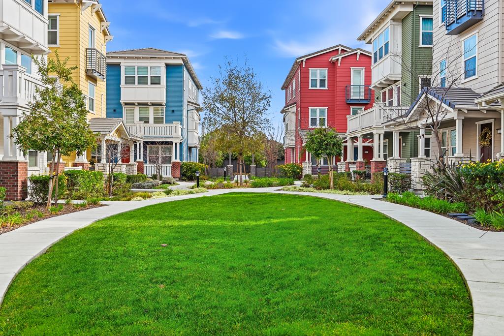 2287 Mora Place Mountain View, CA 94040 - Photo 62 of 64 a front view of a residential apartment building with a yard