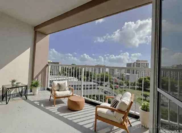 a view of balcony with a potted plant and a table