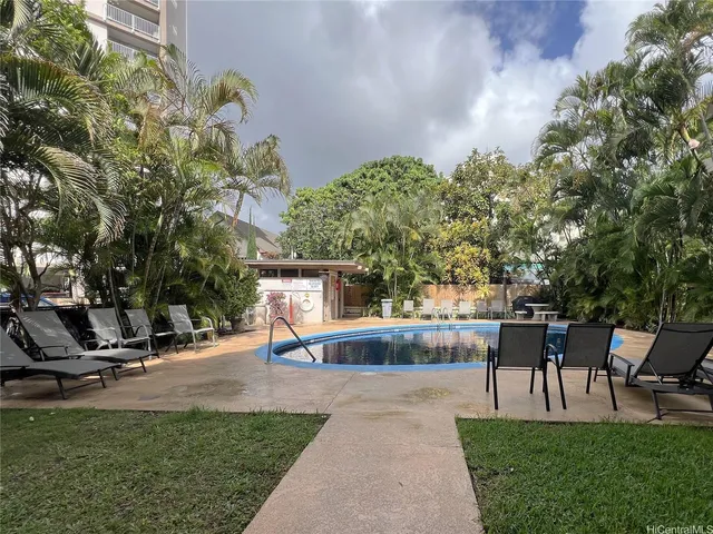 a view of a patio with a table and chairs