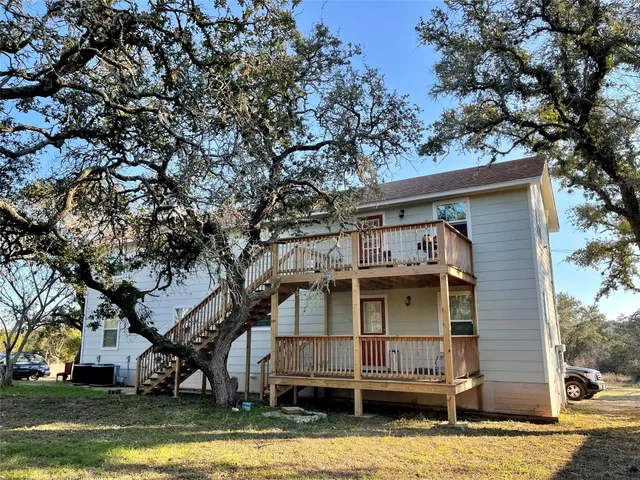 a view of a house with a small yard