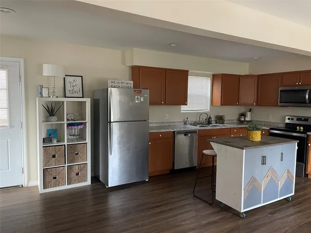 a view of a livingroom with wooden floor