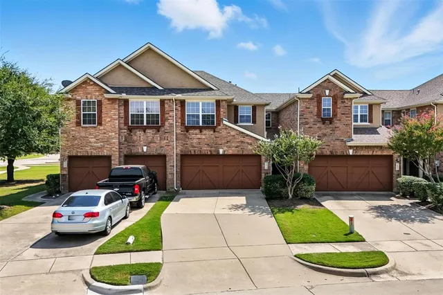 a view of house with yard and outdoor seating