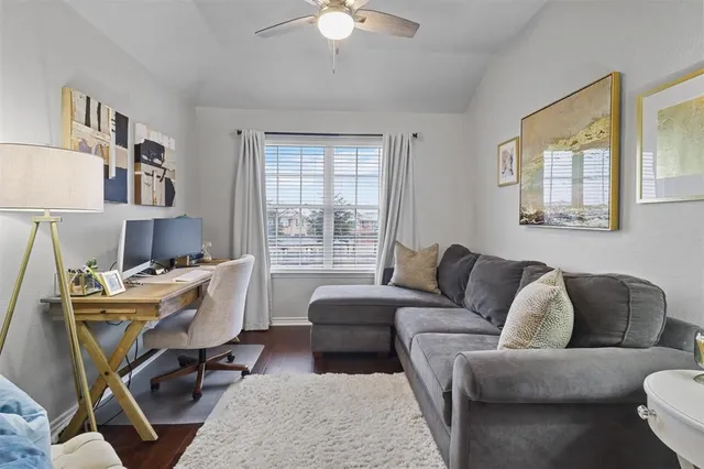a living room with furniture a chandelier and a window