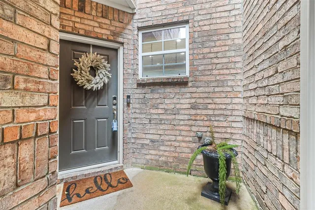 a couple of potted plants in front of door