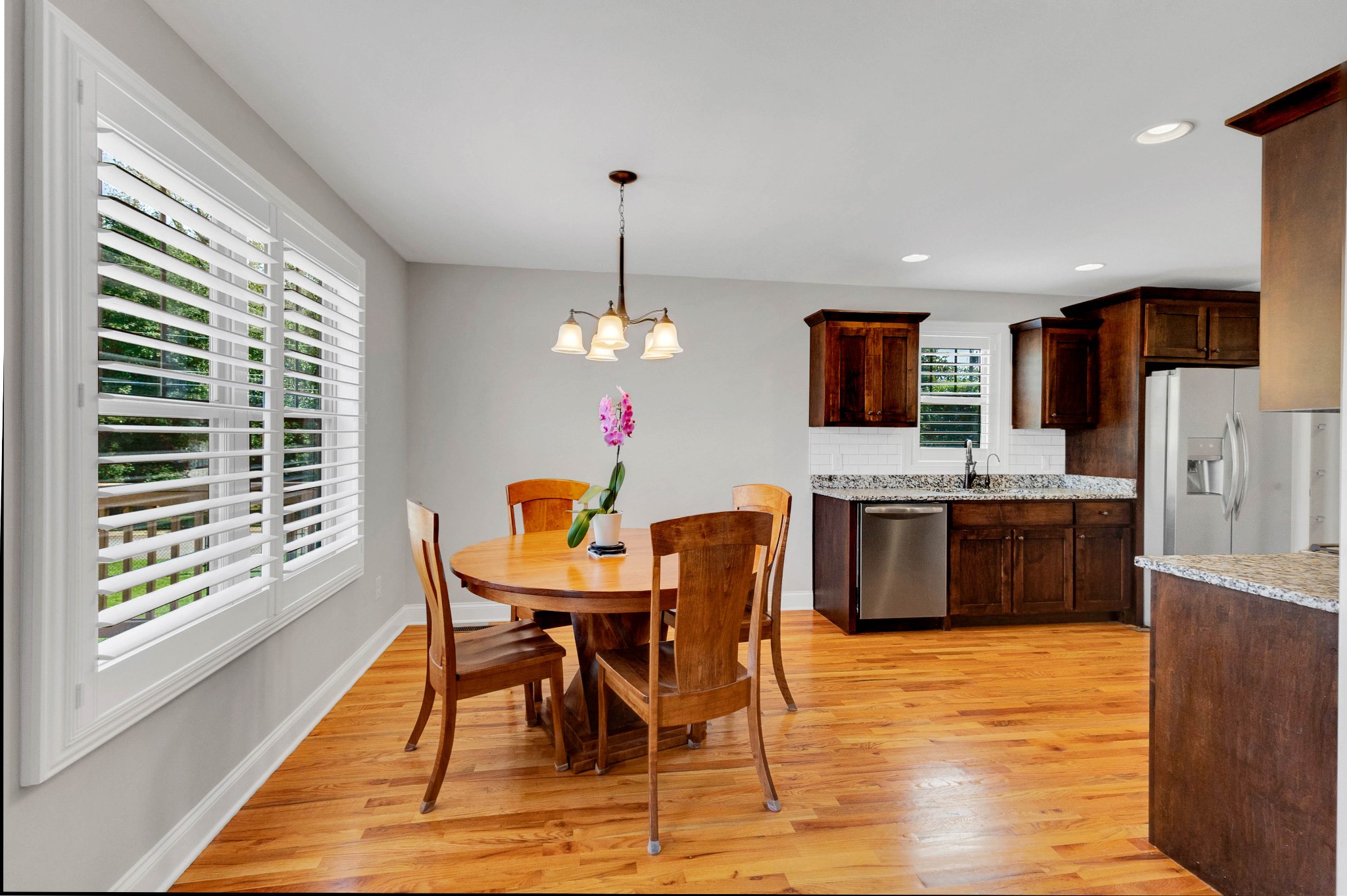 509 Gunn Lane Springfield, TN 37172 - Photo 11 of 48 a kitchen with stainless steel appliances kitchen island granite countertop a dining table chairs and a refrigerator