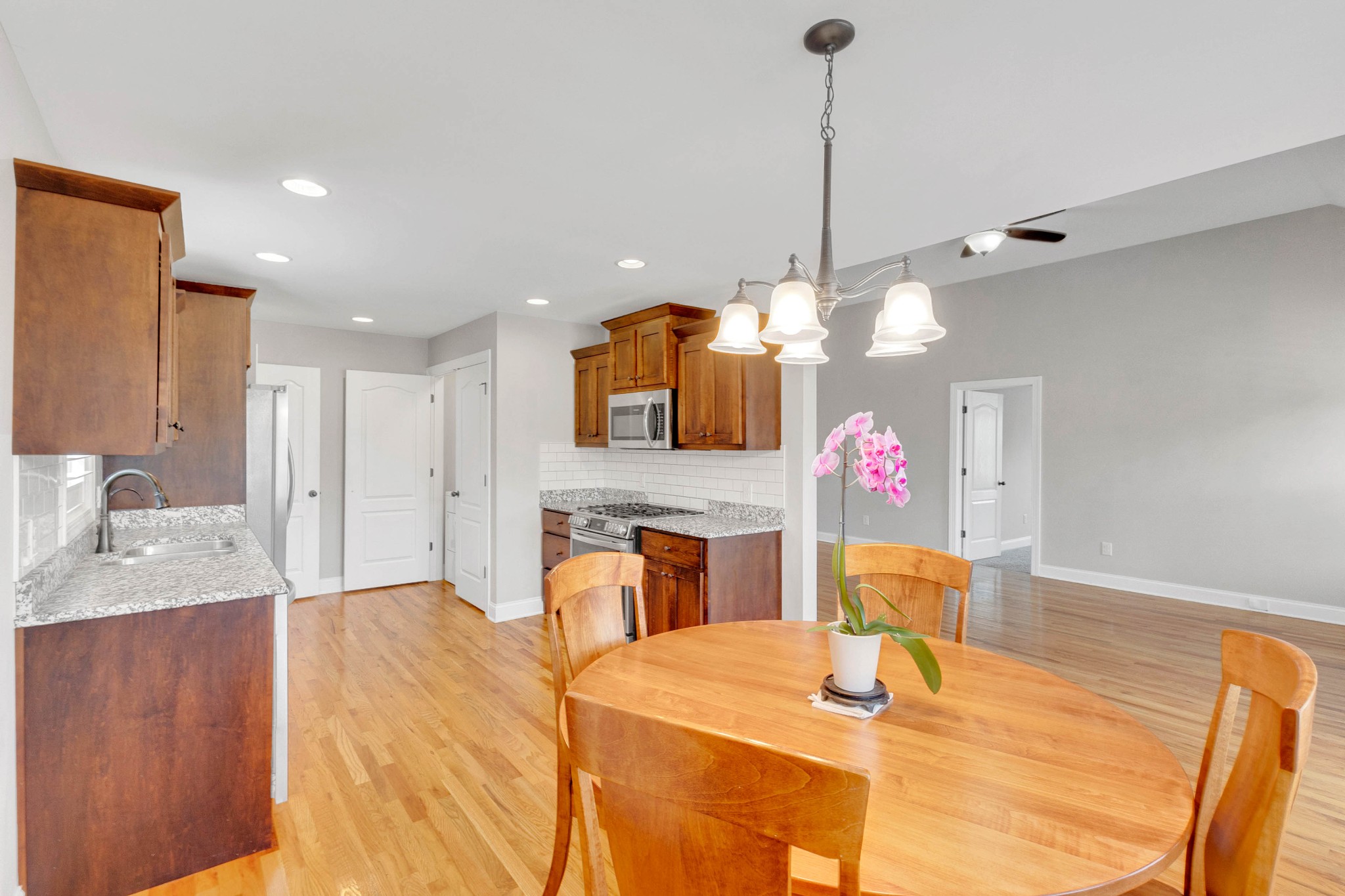 509 Gunn Lane Springfield, TN 37172 - Photo 13 of 48 a kitchen with stainless steel appliances kitchen island granite countertop a sink cabinets and wooden floor