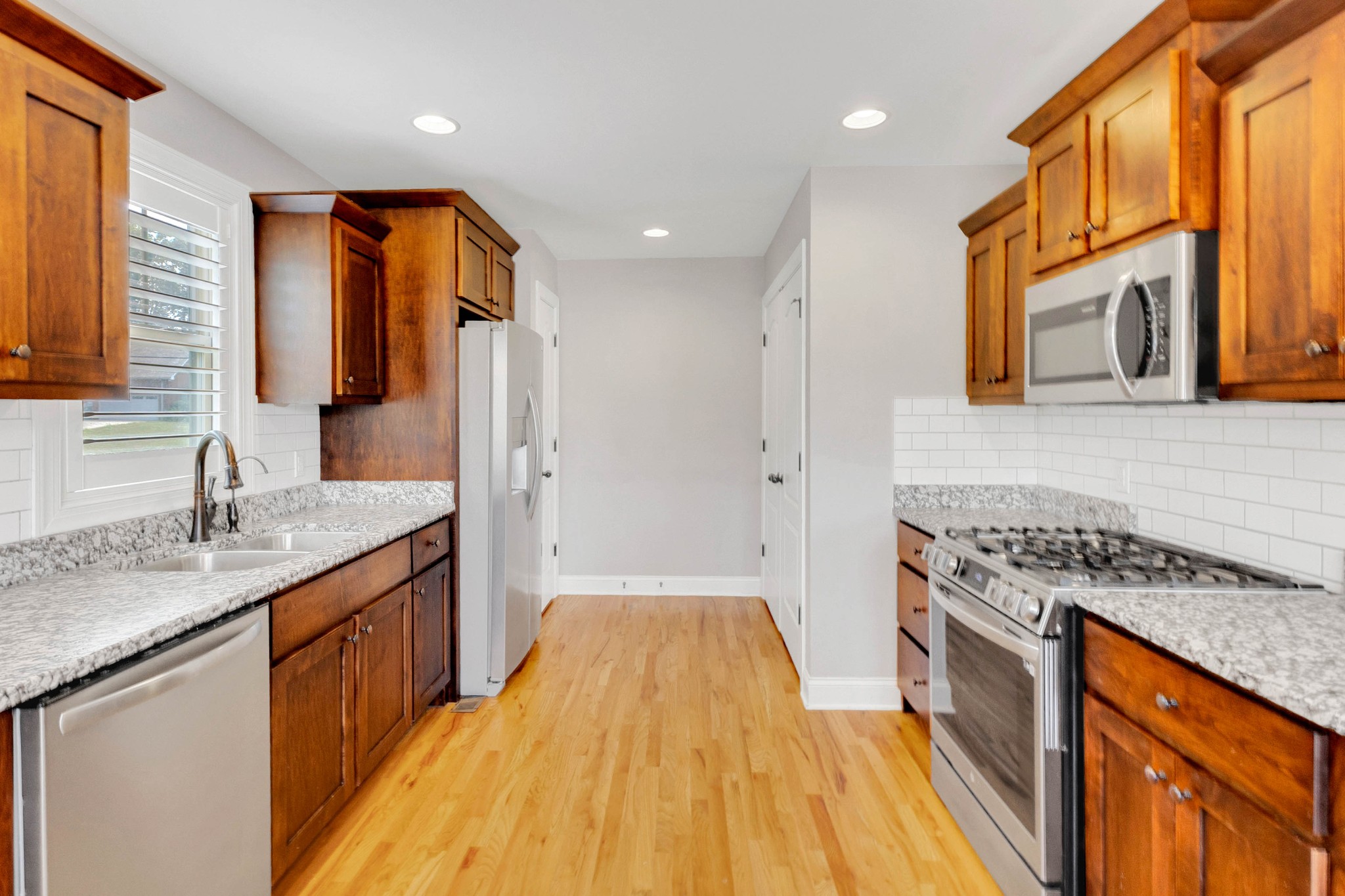 509 Gunn Lane Springfield, TN 37172 - Photo 17 of 48 a bathroom with a granite countertop sink a mirror and a shower