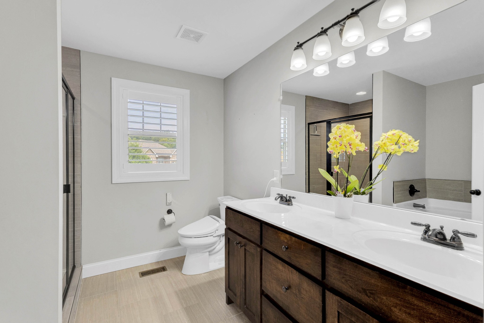 509 Gunn Lane Springfield, TN 37172 - Photo 38 of 48 a bathroom with a double vanity sink toilet and a mirror