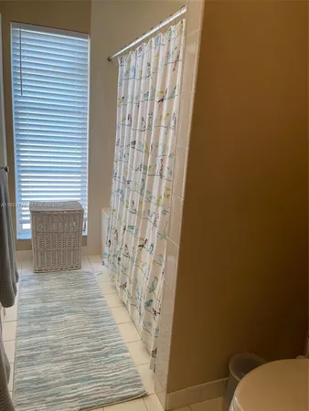 a view of a house with a swimming pool and a big yard