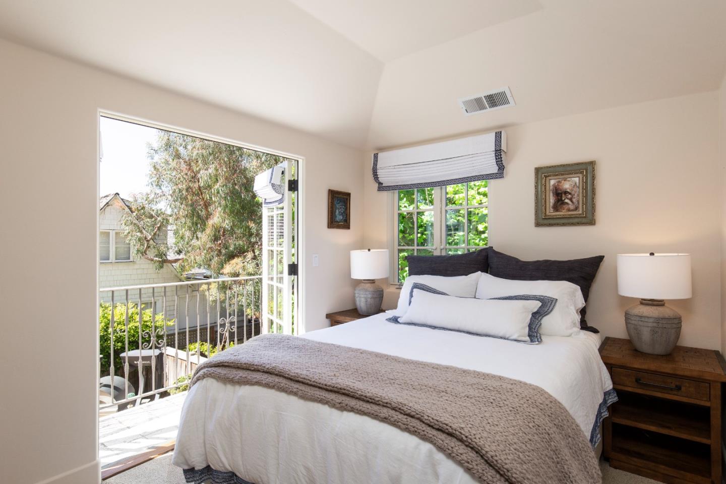 0 Southwest Sw Corner Carmel, CA 93923 - Photo 18 of 30 a bedroom with a large bed and a window