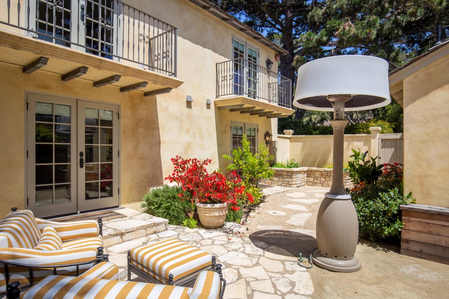0 Southwest Sw Corner Carmel, CA 93923 - Photo 23 of 30 a view of a patio with a table and chairs under an umbrella with potted plants