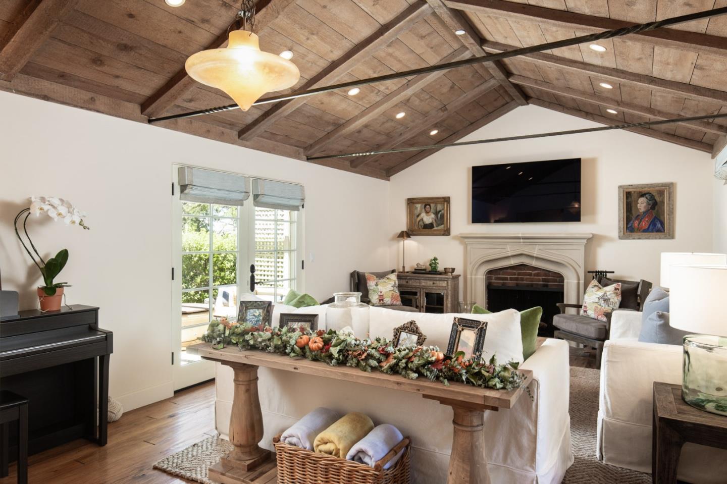 0 Southwest Sw Corner Carmel, CA 93923 - Photo 4 of 30 a living room with furniture a fireplace and a flat screen tv