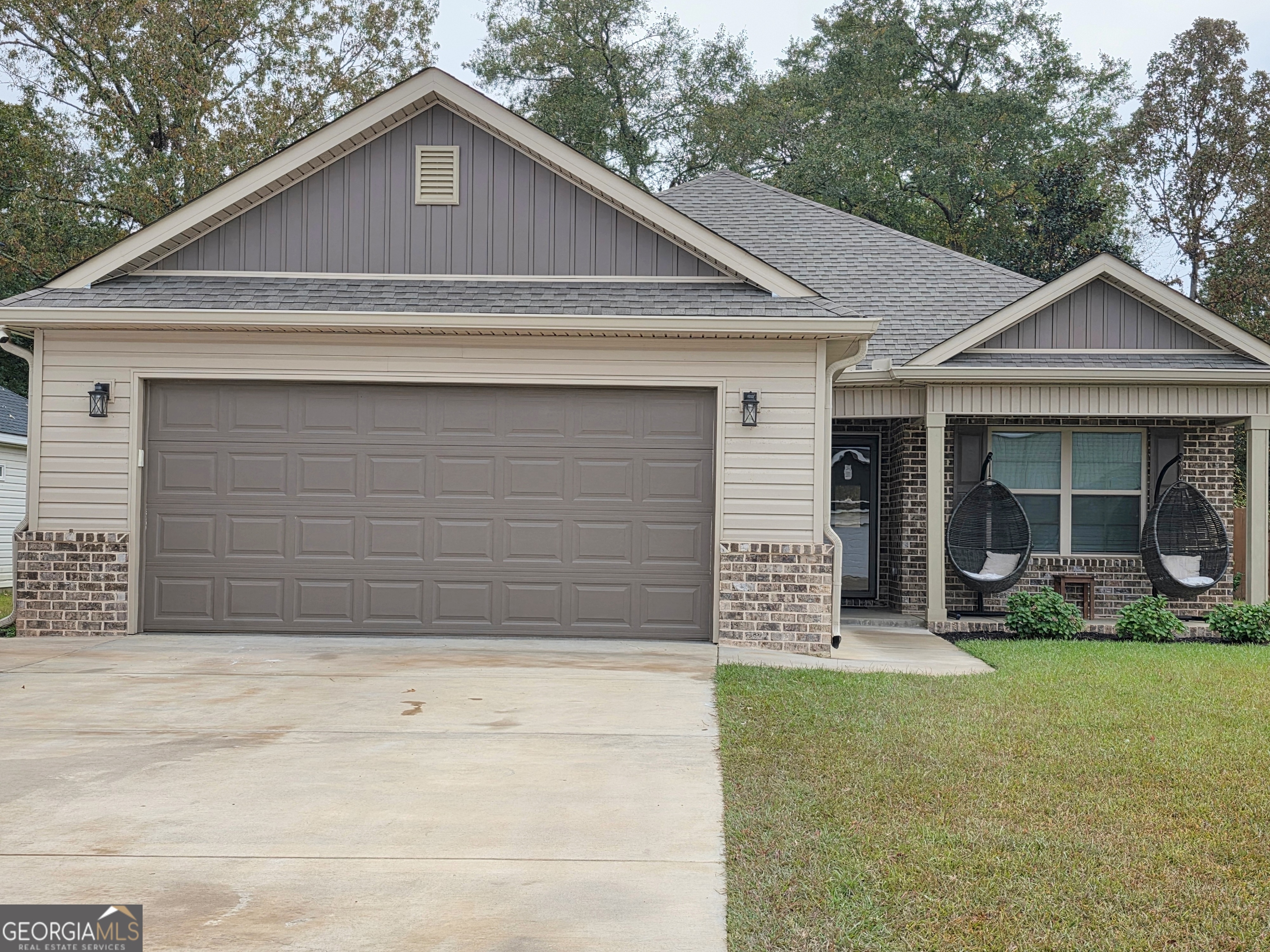a front view of a house with garden