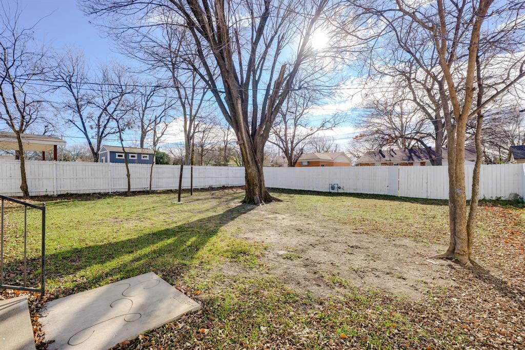 2824 Lockhart Avenue Dallas, TX 75228 - Photo 15 of 16 a view of backyard with wooden fence