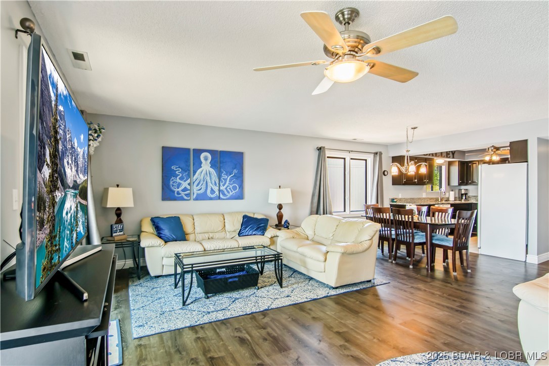 889 Malibu Road, Unit 63 Osage Beach, MO 65065 - Photo 14 of 47 The living room is open and cozy. Just off frame